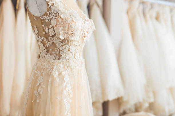 Elegant lace dress on dummy in wedding fashion shop préparatif mariée